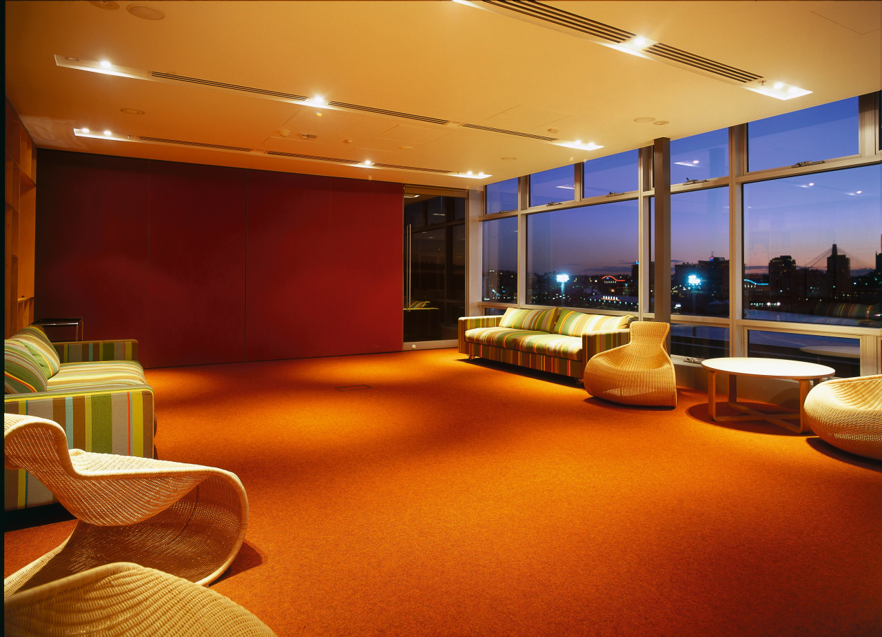 Office meeting room with striped couches and cane ceiling, interior design, lighting, lobby, brown