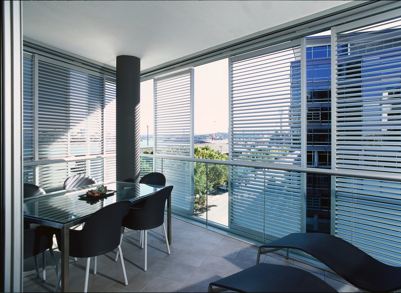 Dining area of apartment with slimline shutters at apartment, condominium, daylighting, glass, interior design, property, real estate, shade, window, window blind, window covering, window treatment, gray