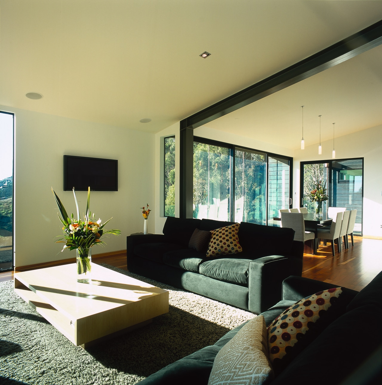 View of the living area, wooden flooring, large ceiling, house, interior design, living room, property, real estate, room, table, window, orange