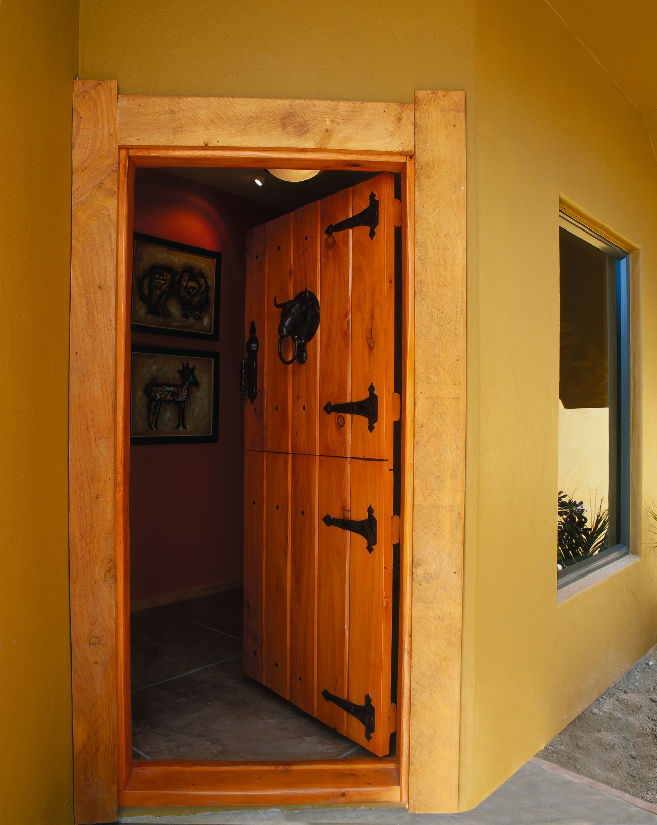 View of the front entrance of this home door, home, house, wall, window, wood, brown, orange