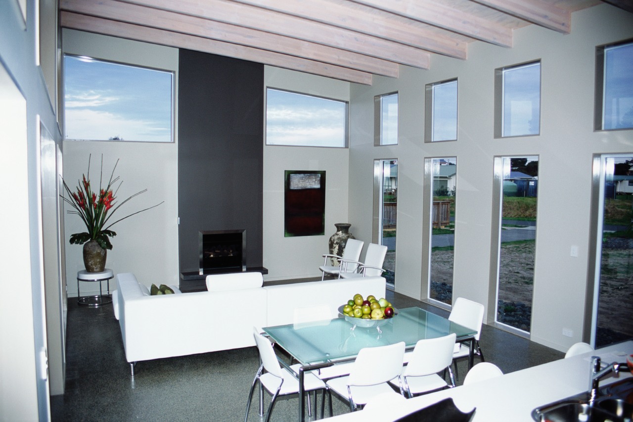 View of the main living area of this daylighting, house, interior design, real estate, window, gray, white