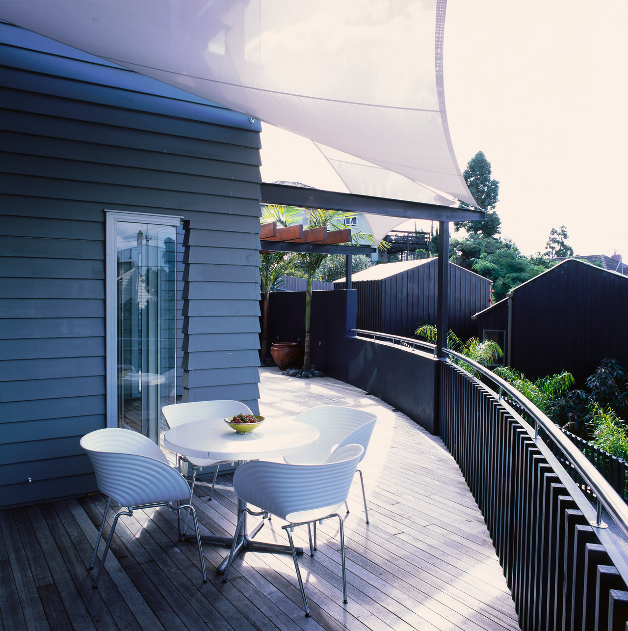 exterior view of deck and living area apartment, architecture, balcony, home, house, outdoor structure, real estate, roof, shade, black, white