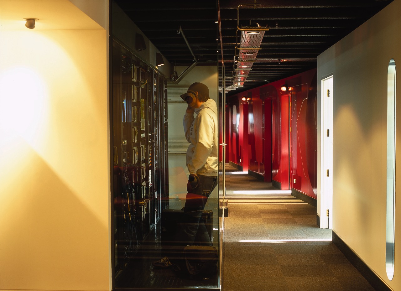 Hallway in office with glass walls in line ceiling, interior design, black, orange