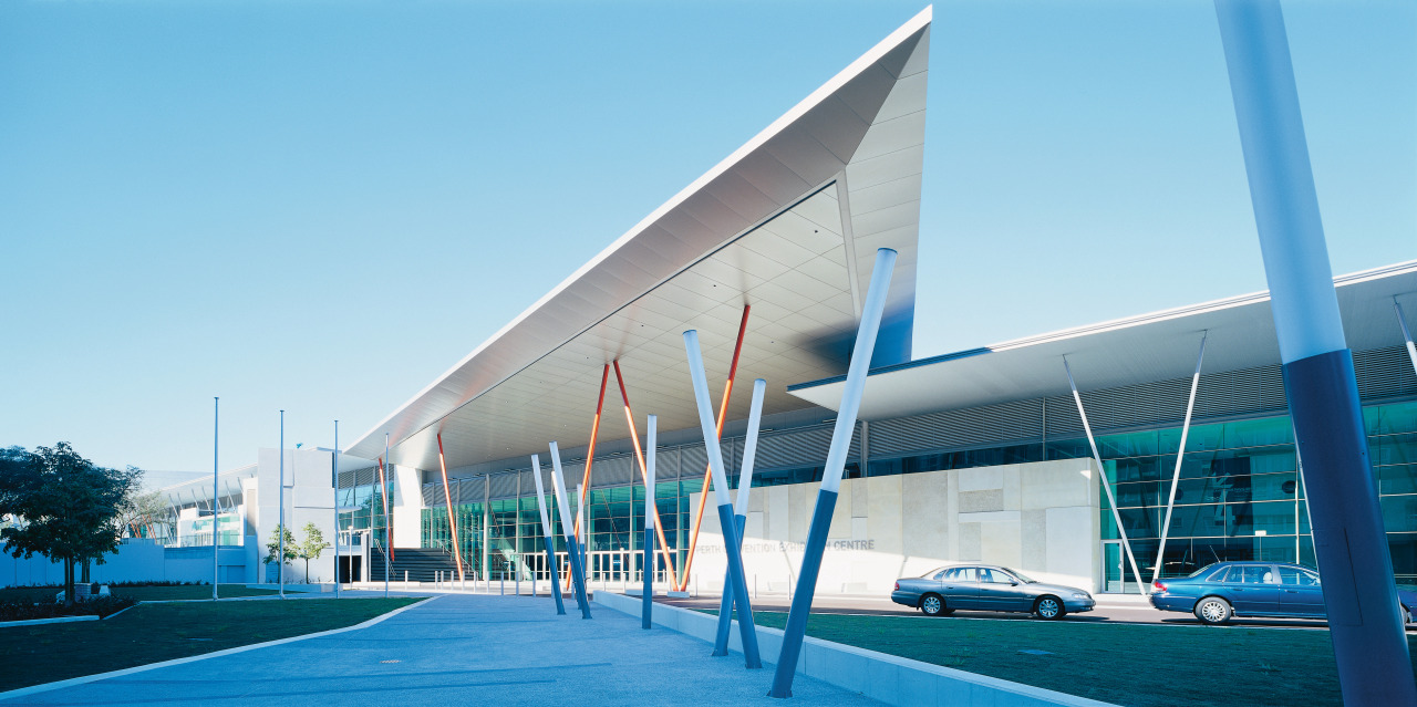 External view of convention centre, featuring zinc cladding architecture, building, commercial building, corporate headquarters, facade, headquarters, leisure centre, mixed use, real estate, sky, structure, teal