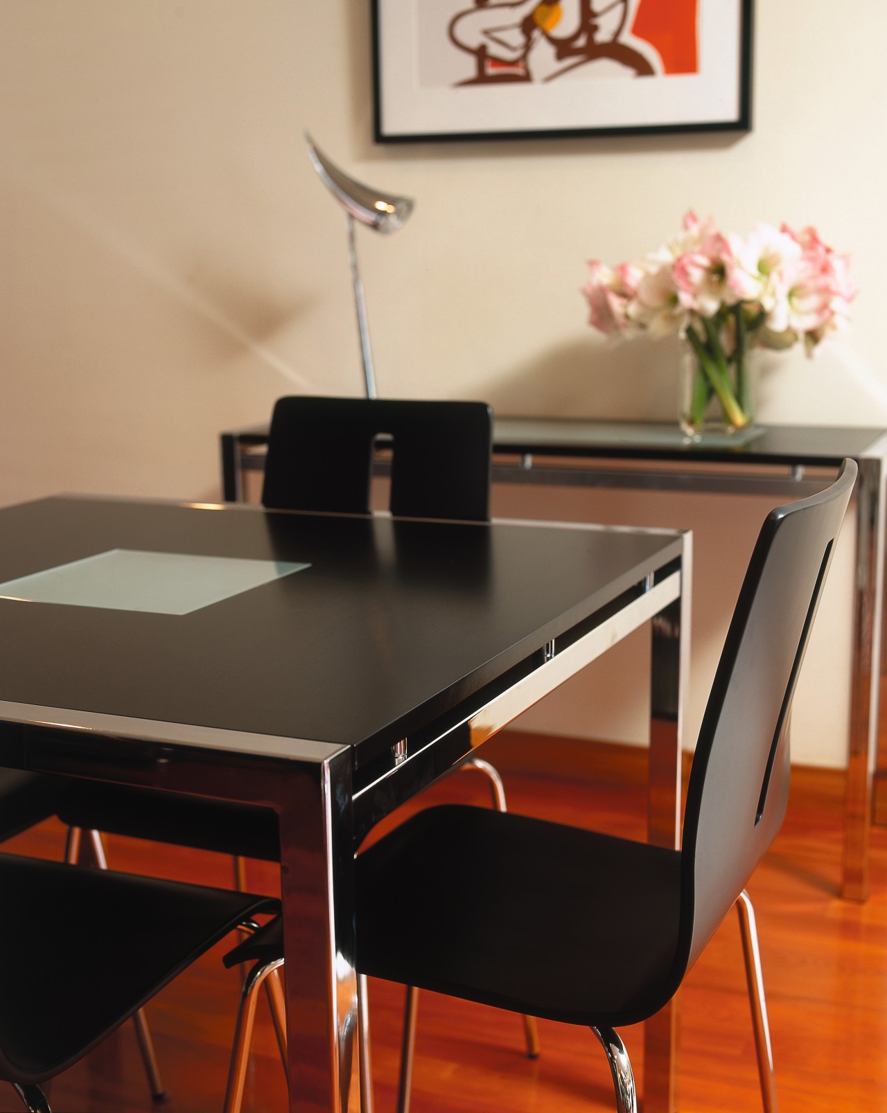 Black dining table and chairs, with square chrome chair, desk, dining room, furniture, interior design, office, product design, table, orange, black