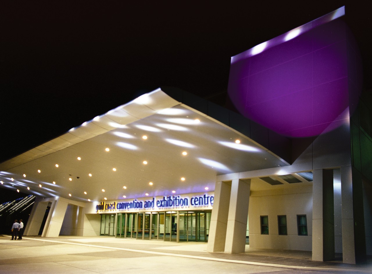 Night view of entrance of convention centre, with architecture, ceiling, daylighting, lighting, structure, black