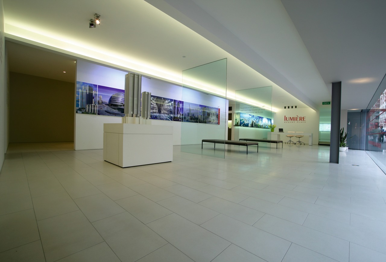 Showroom area with cream stone floor tiles, low exhibition, floor, interior design, lobby, real estate, tourist attraction, gray