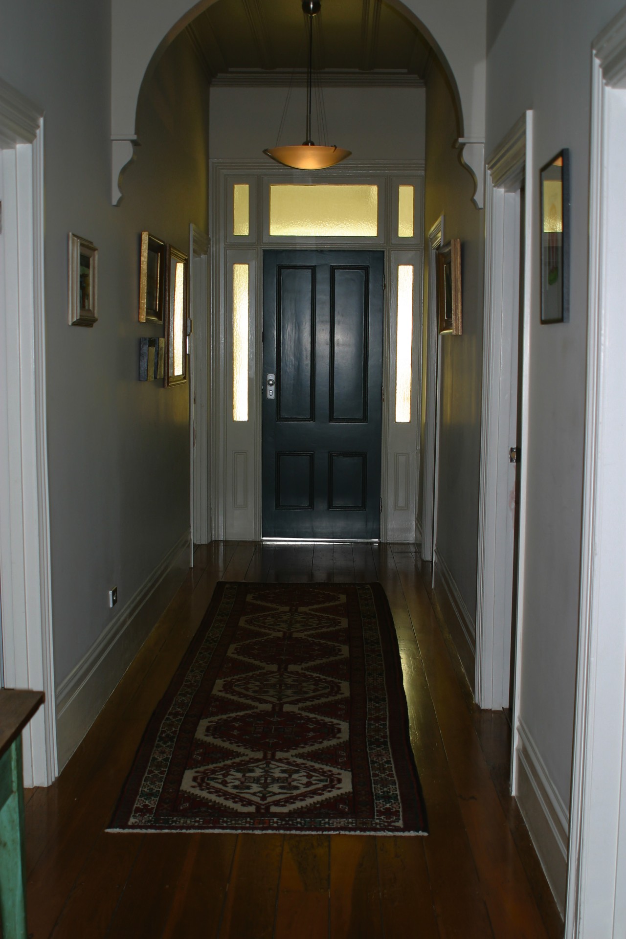 Hallway of villa with timber floor, long runner ceiling, door, estate, floor, flooring, hall, hardwood, home, house, interior design, laminate flooring, lighting, property, real estate, room, stairs, wall, window, wood, wood flooring, black, gray