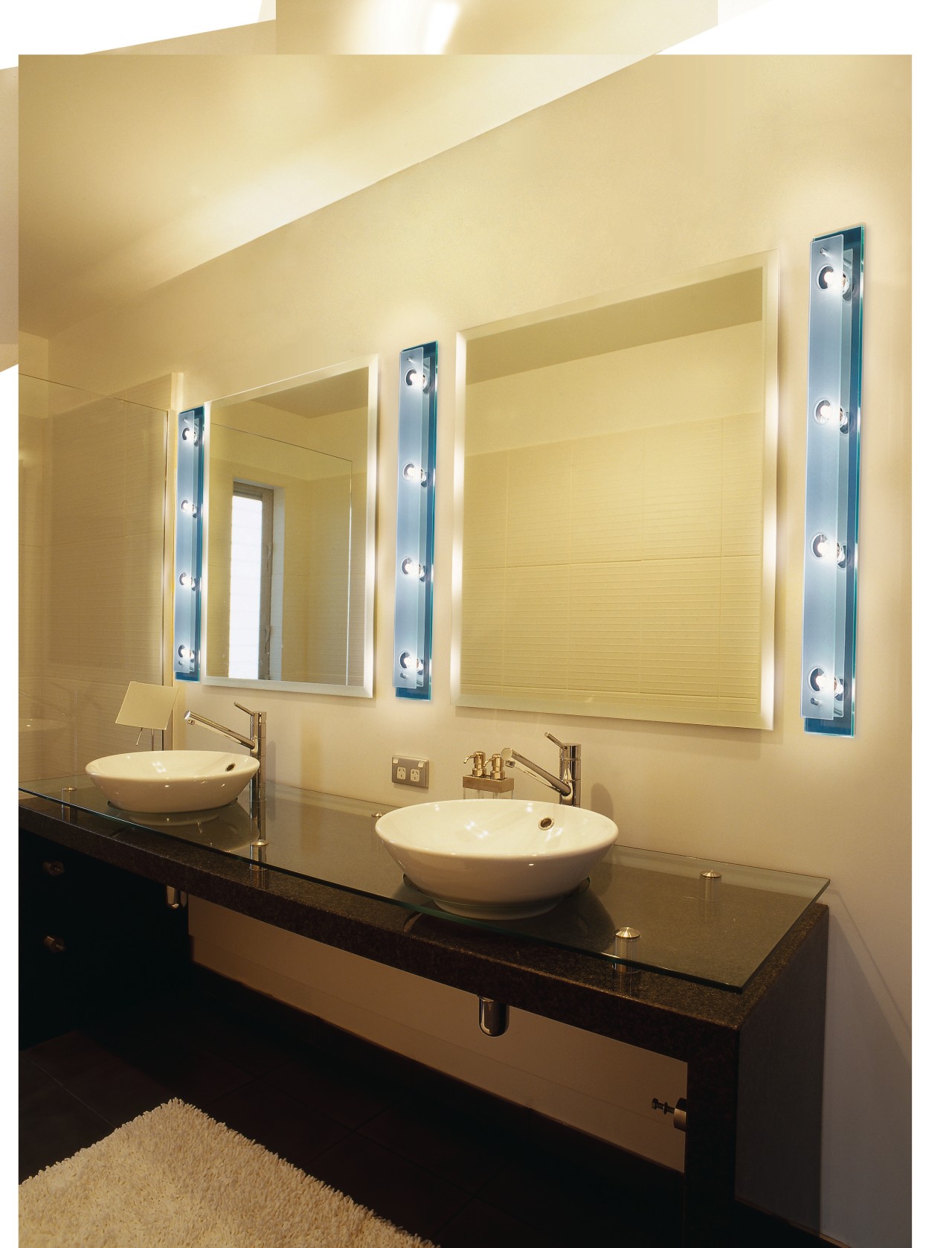 Bathroom with twin white round basins on dark bathroom, bathroom accessory, interior design, lighting, plumbing fixture, product design, room, sink, orange