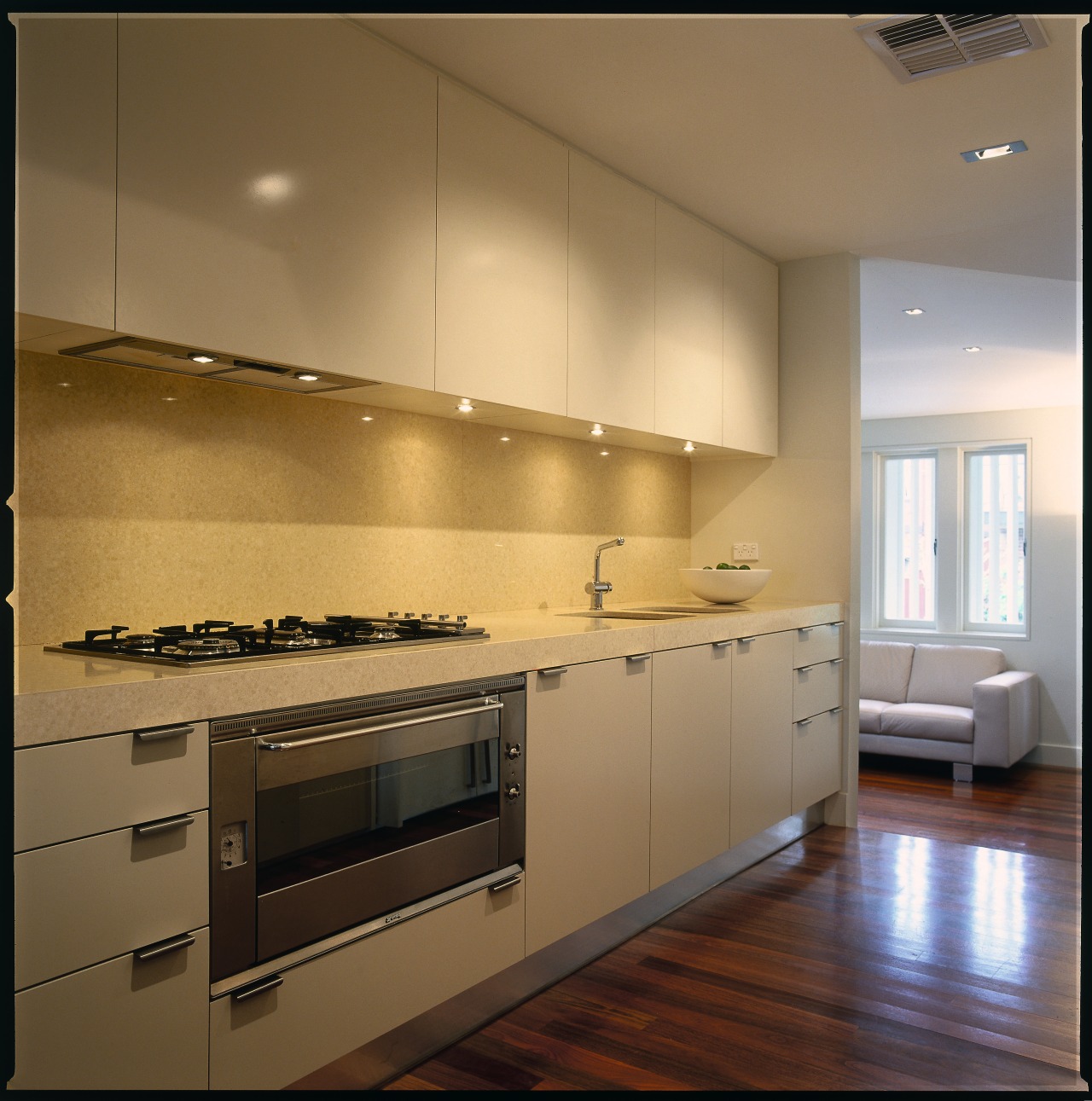 view of the modern kitchen area showing kitchen cabinetry, countertop, cuisine classique, interior design, kitchen, room, under cabinet lighting, brown