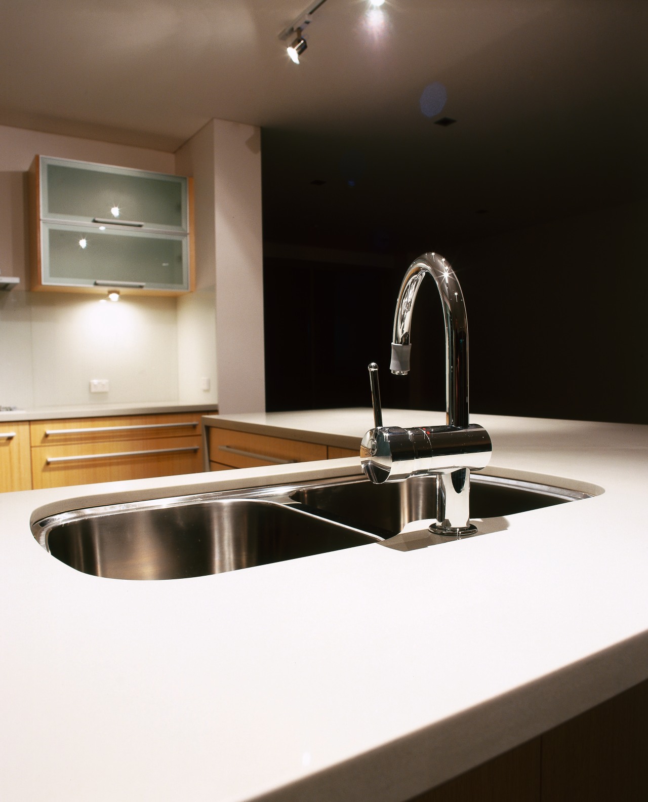 view of a polished stone benchtops countertop, interior design, kitchen, product design, sink, tap, under cabinet lighting, white, black