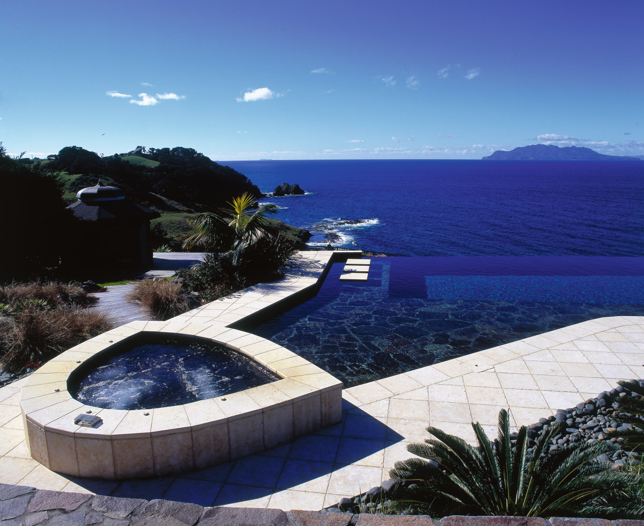 View of a spa and swimming pool on estate, property, sea, sky, swimming pool, water, blue