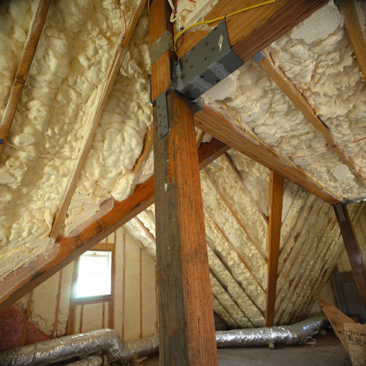 View of the Icynene insulation in the roof. attic, beam, building insulation, ceiling, log cabin, lumber, roof, wood, brown