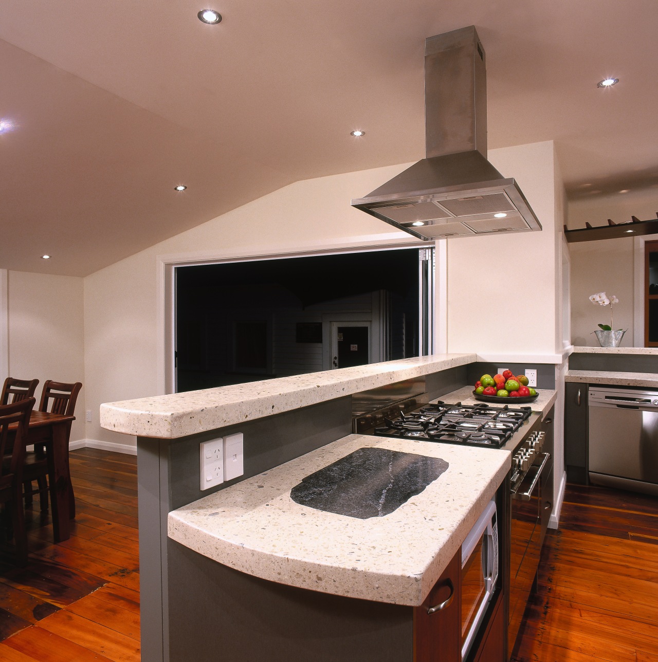 Kitchen with light coloured polished concrete benchtop and cabinetry, countertop, floor, flooring, hardwood, interior design, kitchen, room, wood flooring, brown, gray