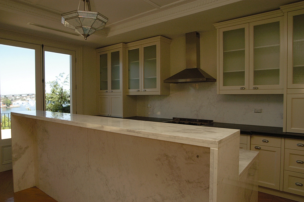 view of the kitchen shoing integrated marble and cabinetry, countertop, cuisine classique, estate, home, kitchen, real estate, room, window, brown