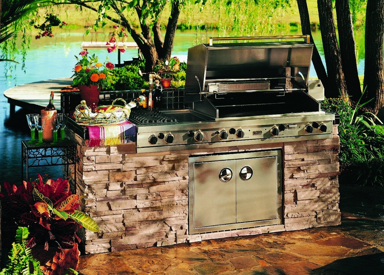 Outdoor barbeque set into stone wall base. backyard, barbecue, barbecue grill, outdoor grill, black