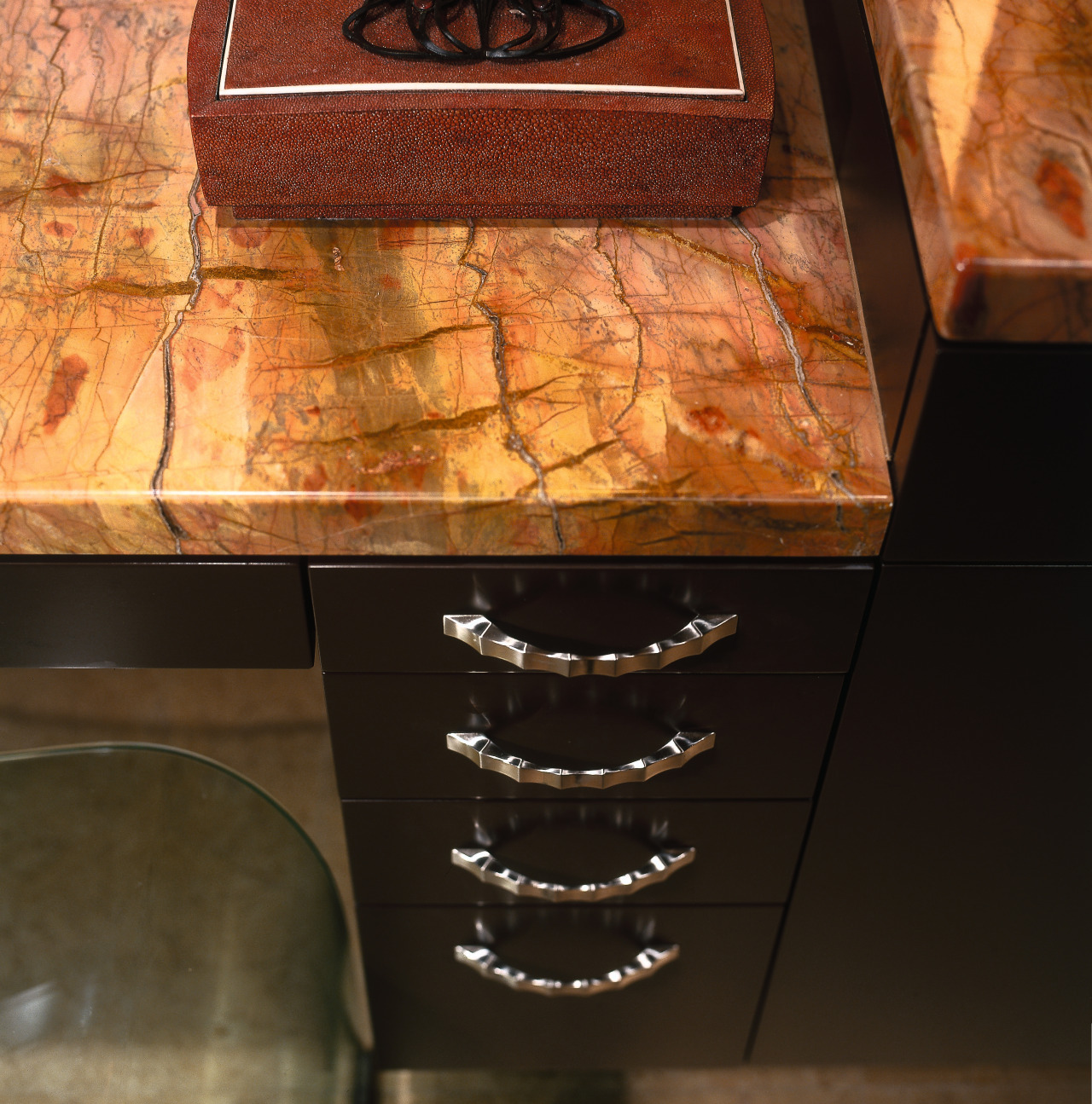 Closeup of bathroom vanity with gold coloured granite floor, flooring, furniture, hardwood, table, wall, wood stain, black