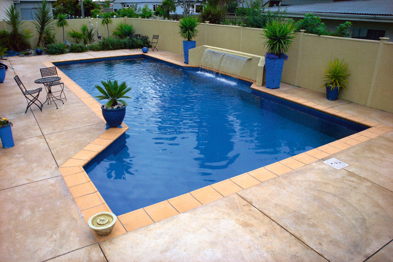 Blue coloured outdoor pool with terracotta coloured paving, backyard, floor, flooring, leisure, property, real estate, swimming pool, gray