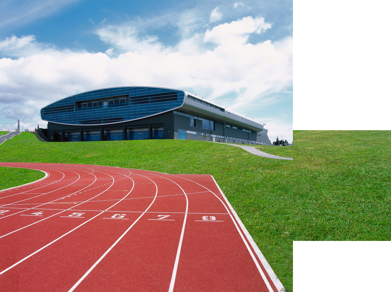 Exterior view of sports stadium building with running grass, line, sky, sport venue, stadium, structure, white