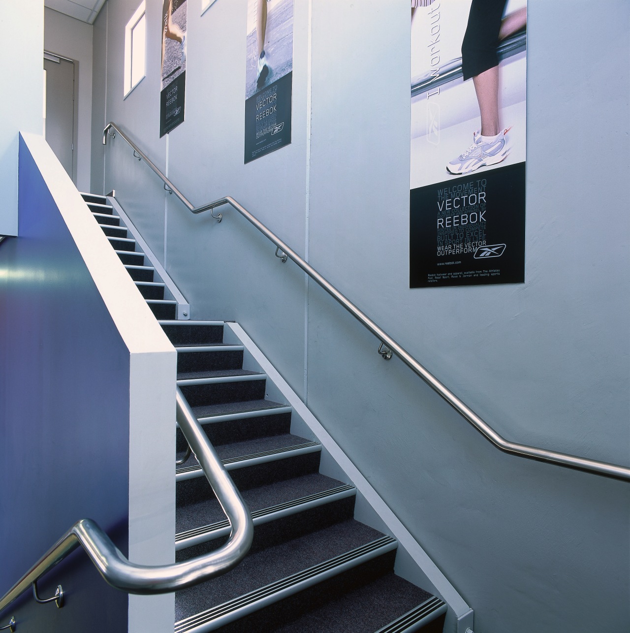 Stairway with off-white and blue walls. glass, handrail, product design, stairs, structure, gray