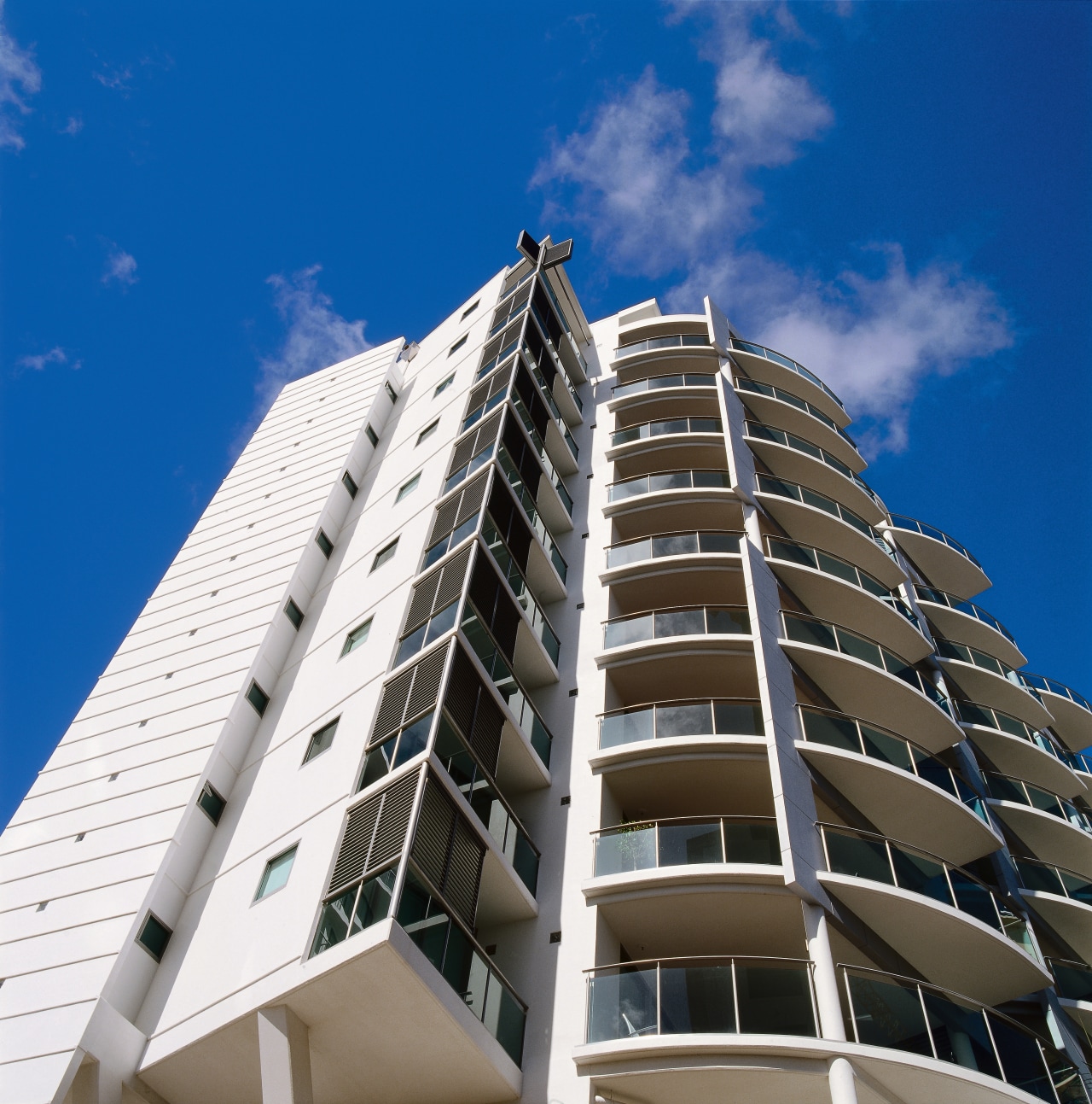 view of the multistorey apartment block apartment, architecture, building, commercial building, condominium, corporate headquarters, daytime, facade, headquarters, metropolis, metropolitan area, mixed use, real estate, residential area, sky, skyscraper, tower block, urban area, blue