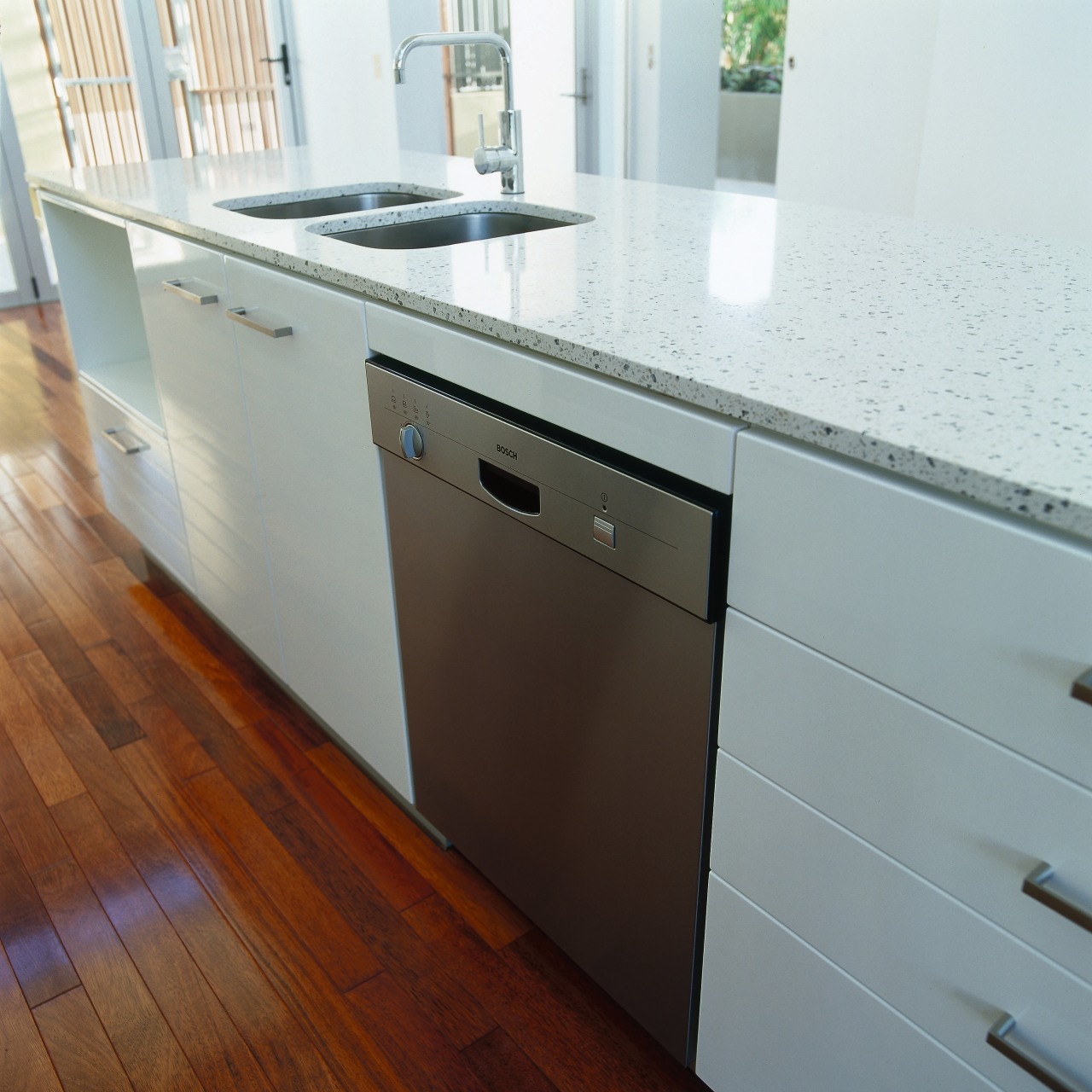view of the bosch dishwasher cabinetry, countertop, floor, flooring, furniture, hardwood, kitchen, sink, wood, gray, white