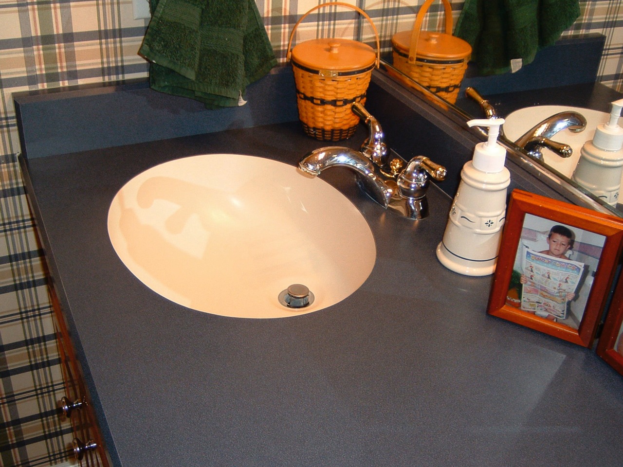 view of  the undermount ktichen sink bathroom, ceramic, countertop, floor, flooring, furniture, plumbing fixture, room, sink, table, tile, black