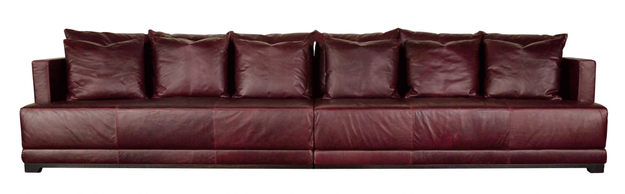 View of a very long, square brown leather couch, furniture, loveseat, sofa bed, red, white