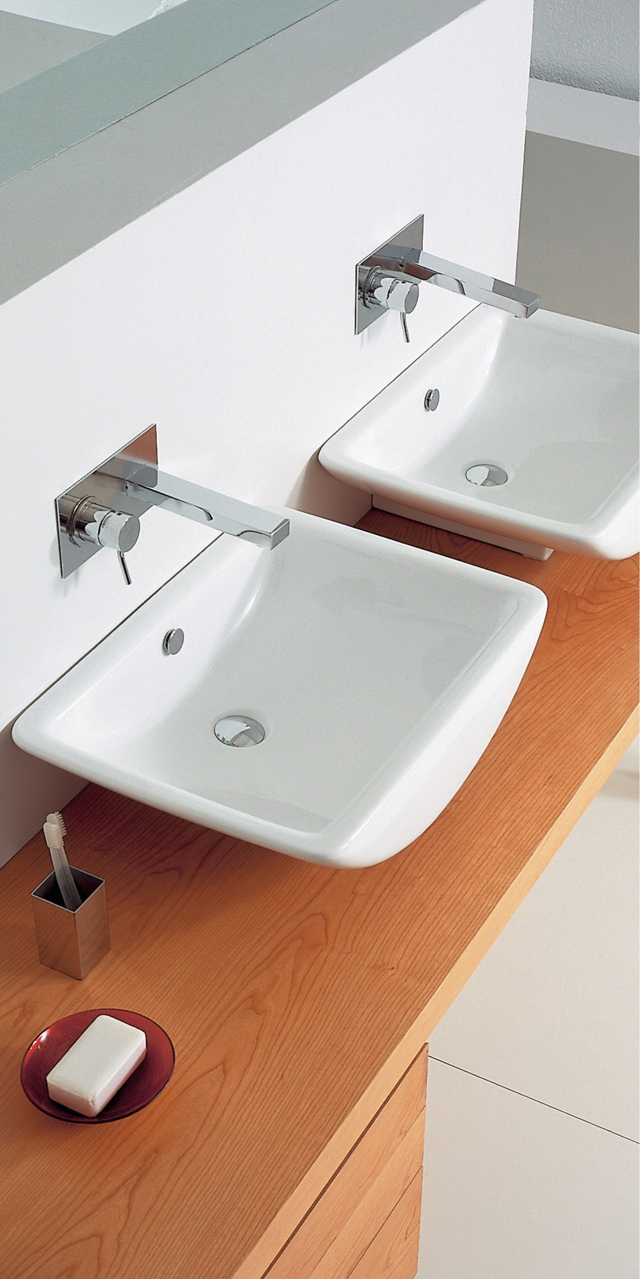 View of a wooden vanity with two curved angle, bathroom, bathroom accessory, bathroom sink, ceramic, countertop, floor, plumbing fixture, product design, sink, tap, white, gray