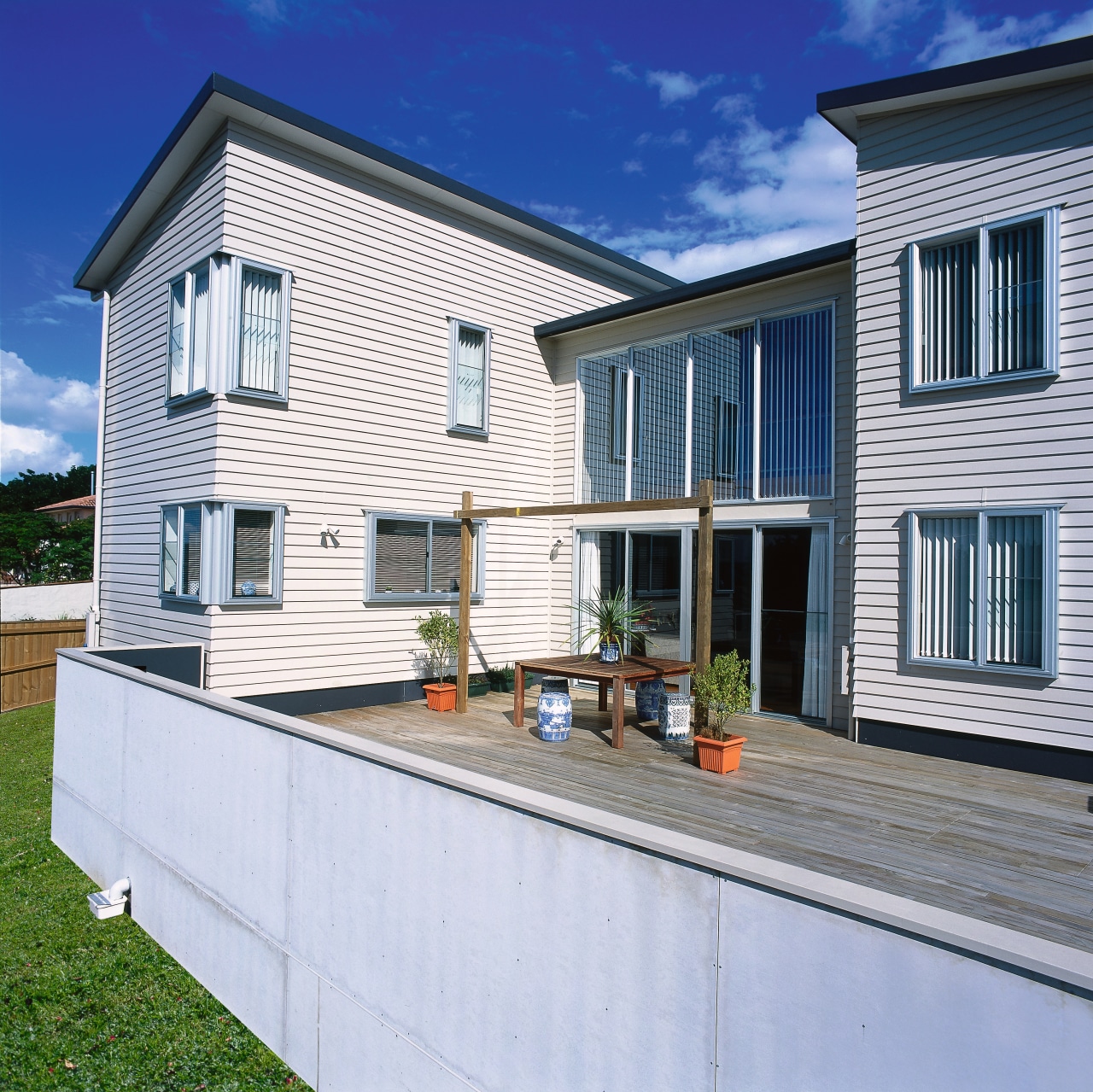 Exterior of two storey home with cream weatherboard cottage, elevation, facade, home, house, property, real estate, residential area, siding, window, gray
