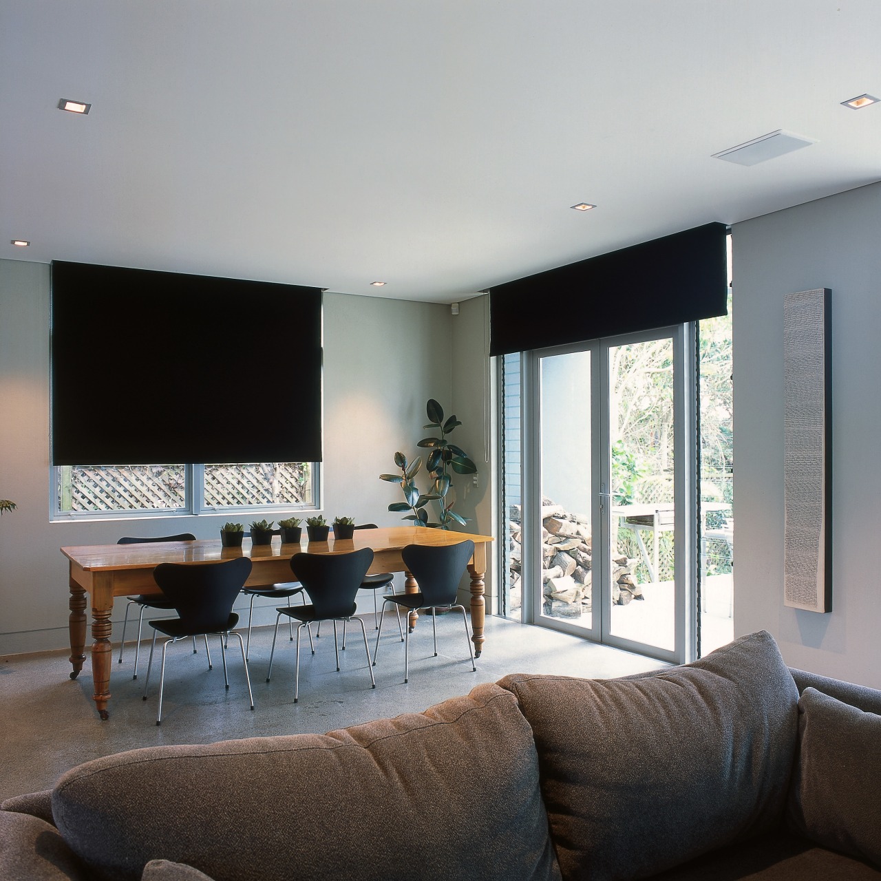 View of a living area, polished concrete floor, architecture, ceiling, house, interior design, living room, real estate, room, table, wall, window, gray, black