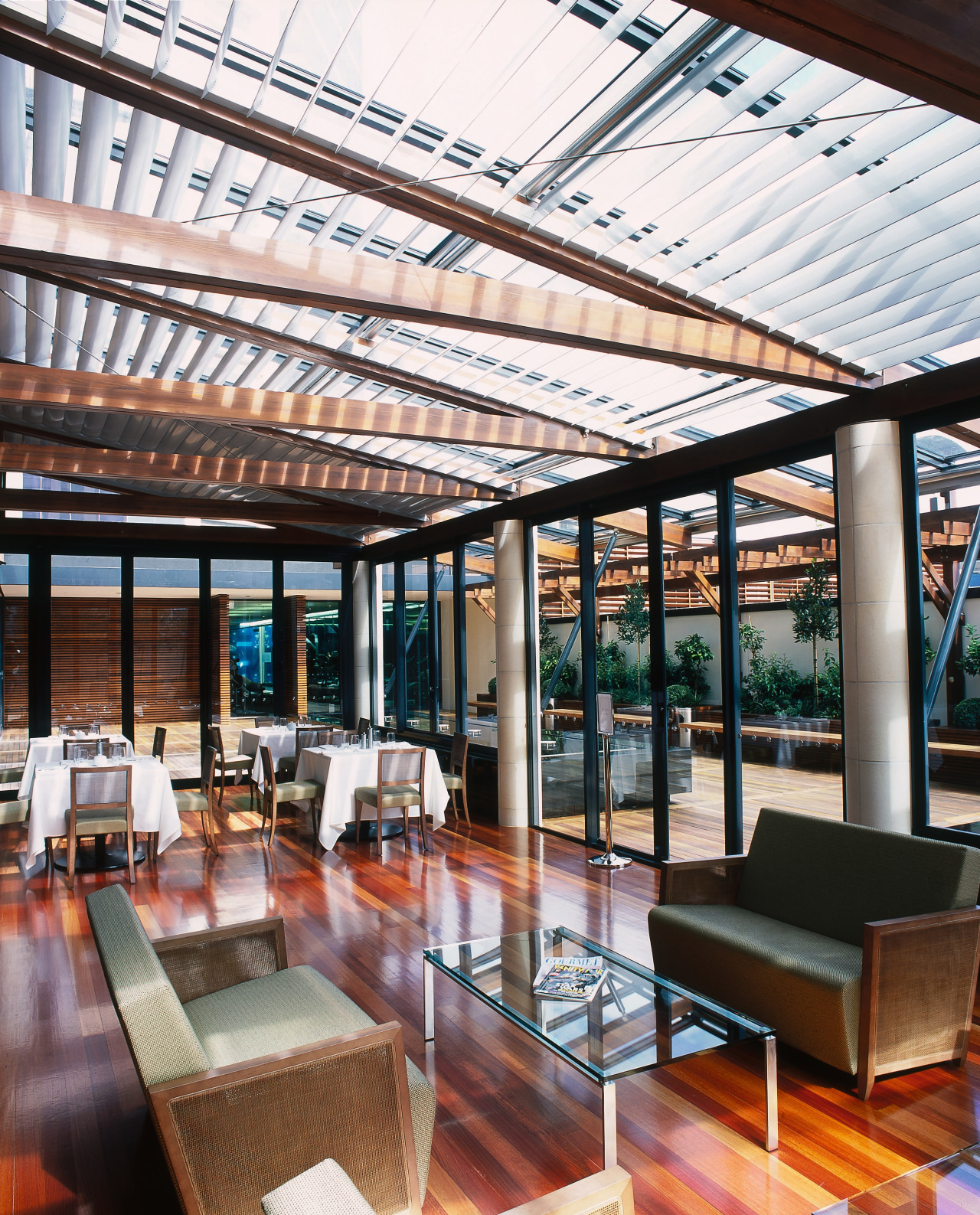 Restaurant sun room area with sofas, tables and daylighting, interior design, real estate, roof, white, black