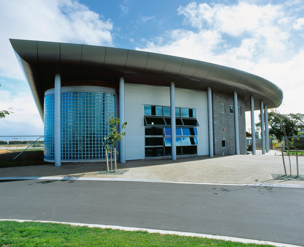 Exterior view of architectural building with blue tinted architecture, building, commercial building, corporate headquarters, facade, structure, gray, white