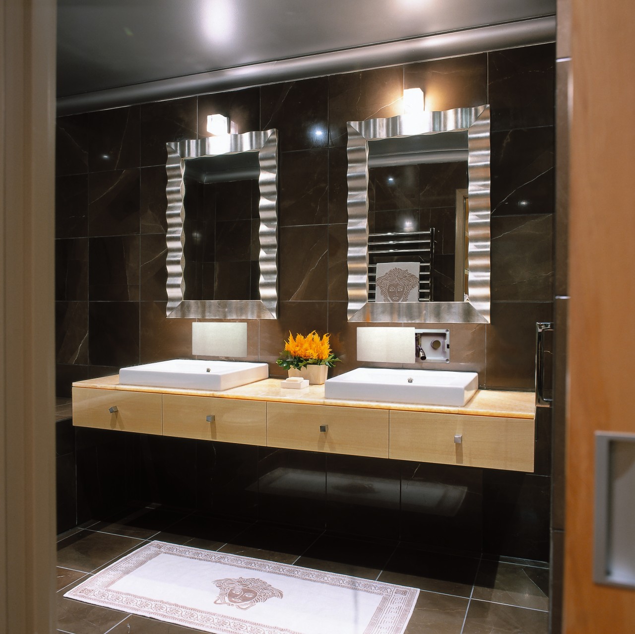 view of the bathroom vanity and stainless faucetry, bathroom, cabinetry, countertop, interior design, kitchen, room, sink, black, brown