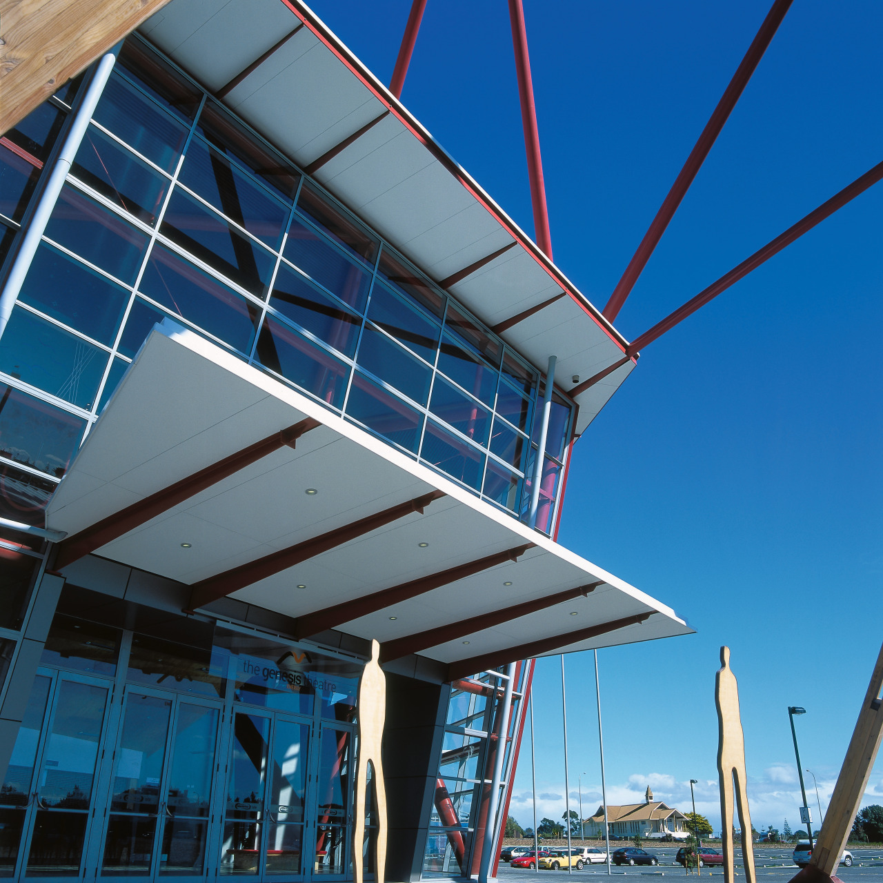 A view of the entrace to a large architecture, blue, building, daylighting, roof, sky, structure, water, blue