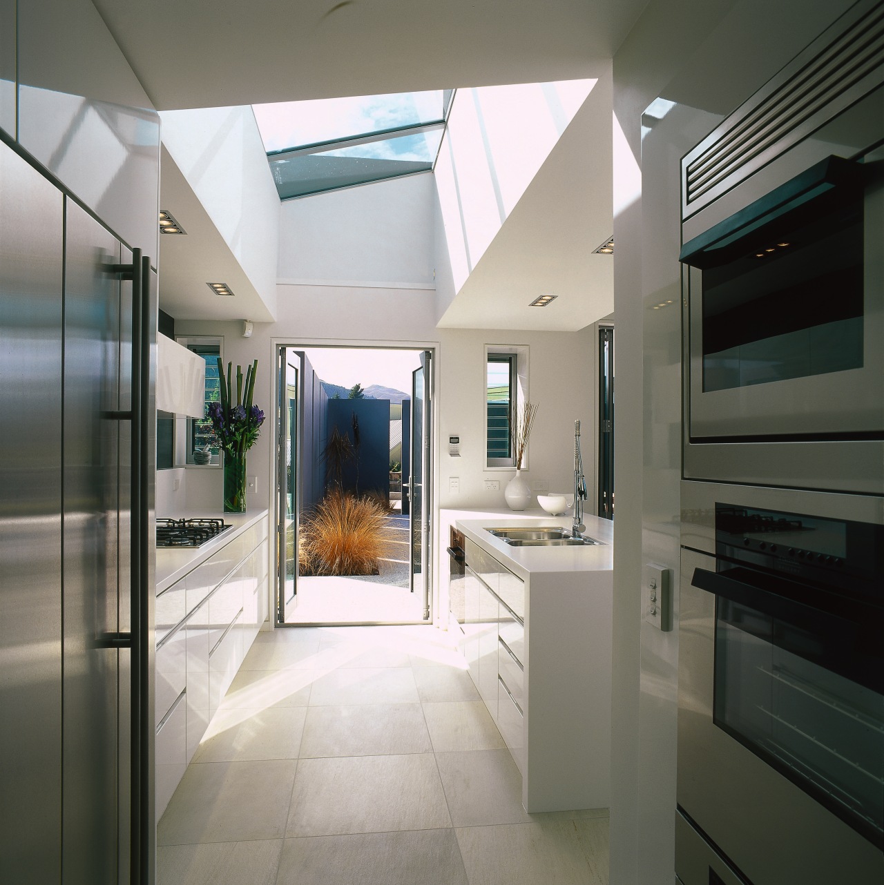 A view of the kitchen area, concrete tiled interior design, gray, black