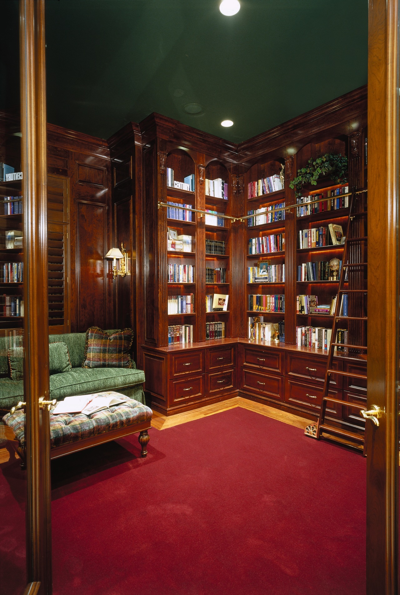 view of the study with a stained dark bookcase, flooring, furniture, institution, interior design, library, lobby, public library, shelving, red