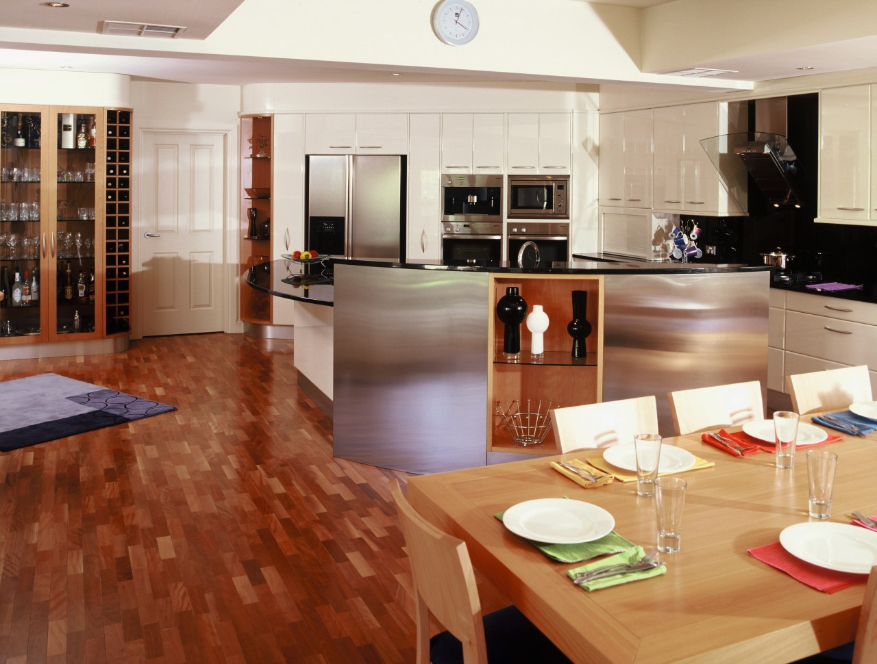 View of kitchen and dining area featuring parquetry countertop, floor, flooring, hardwood, interior design, kitchen, laminate flooring, room, wood, wood flooring