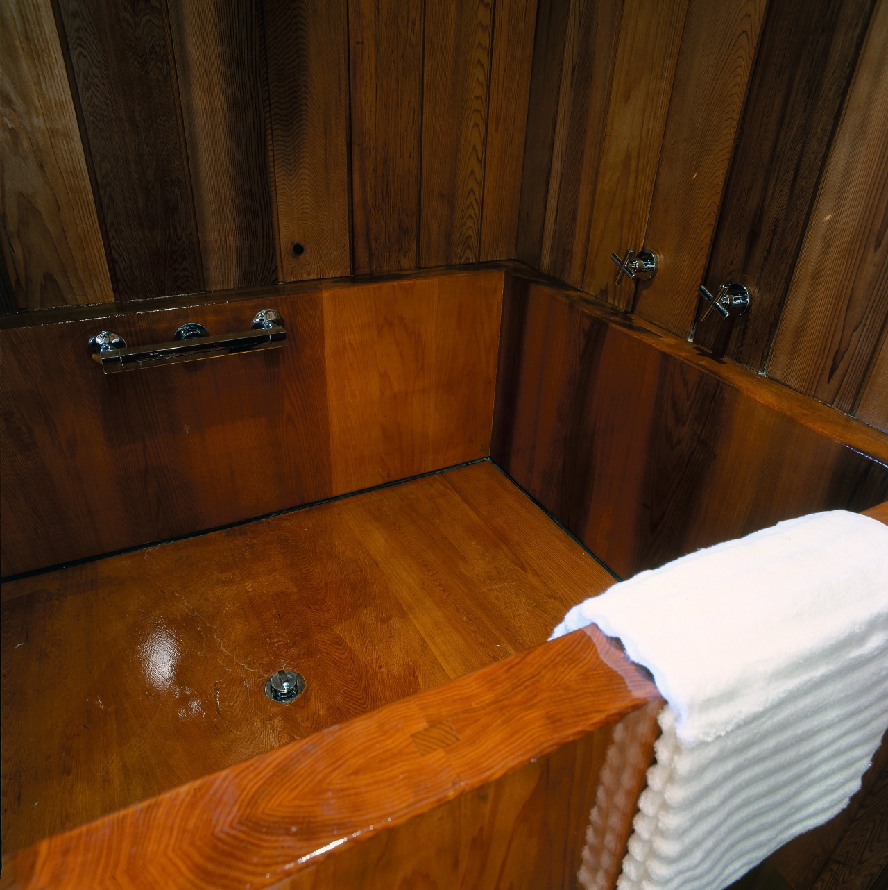 A view of the wooden bathtub. floor, flooring, hardwood, laminate flooring, room, wall, wood, wood flooring, wood stain, brown