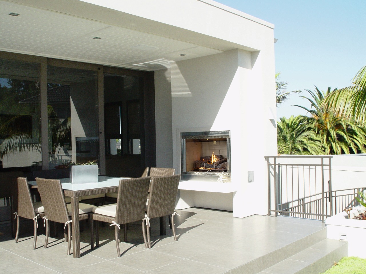 view of the outdoor gas fire located in floor, house, interior design, living room, property, real estate, window, white