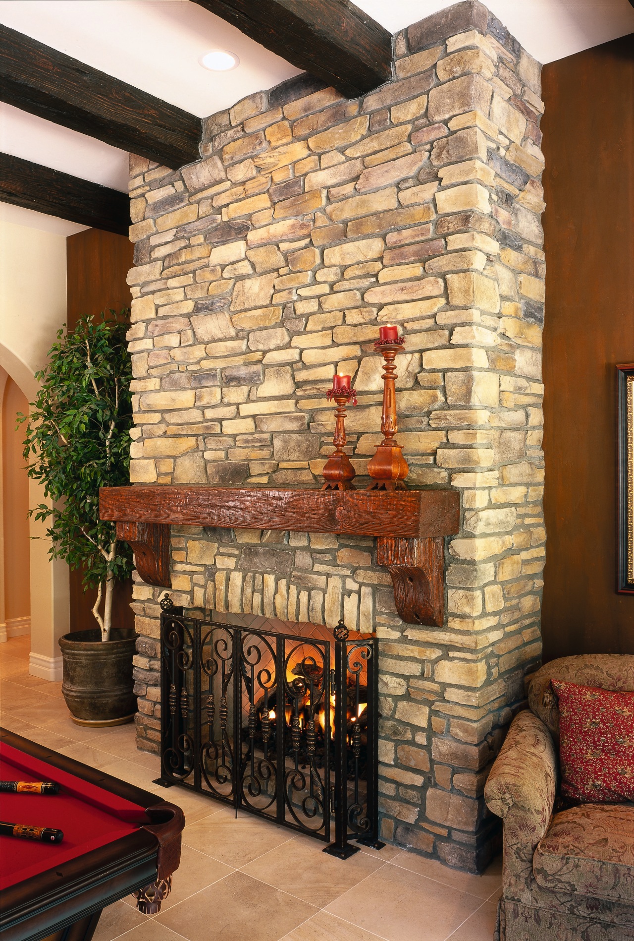 view of the euro-lite ceiling beams and tereka brick, brickwork, fireplace, hearth, interior design, living room, wall, wood burning stove, brown, orange