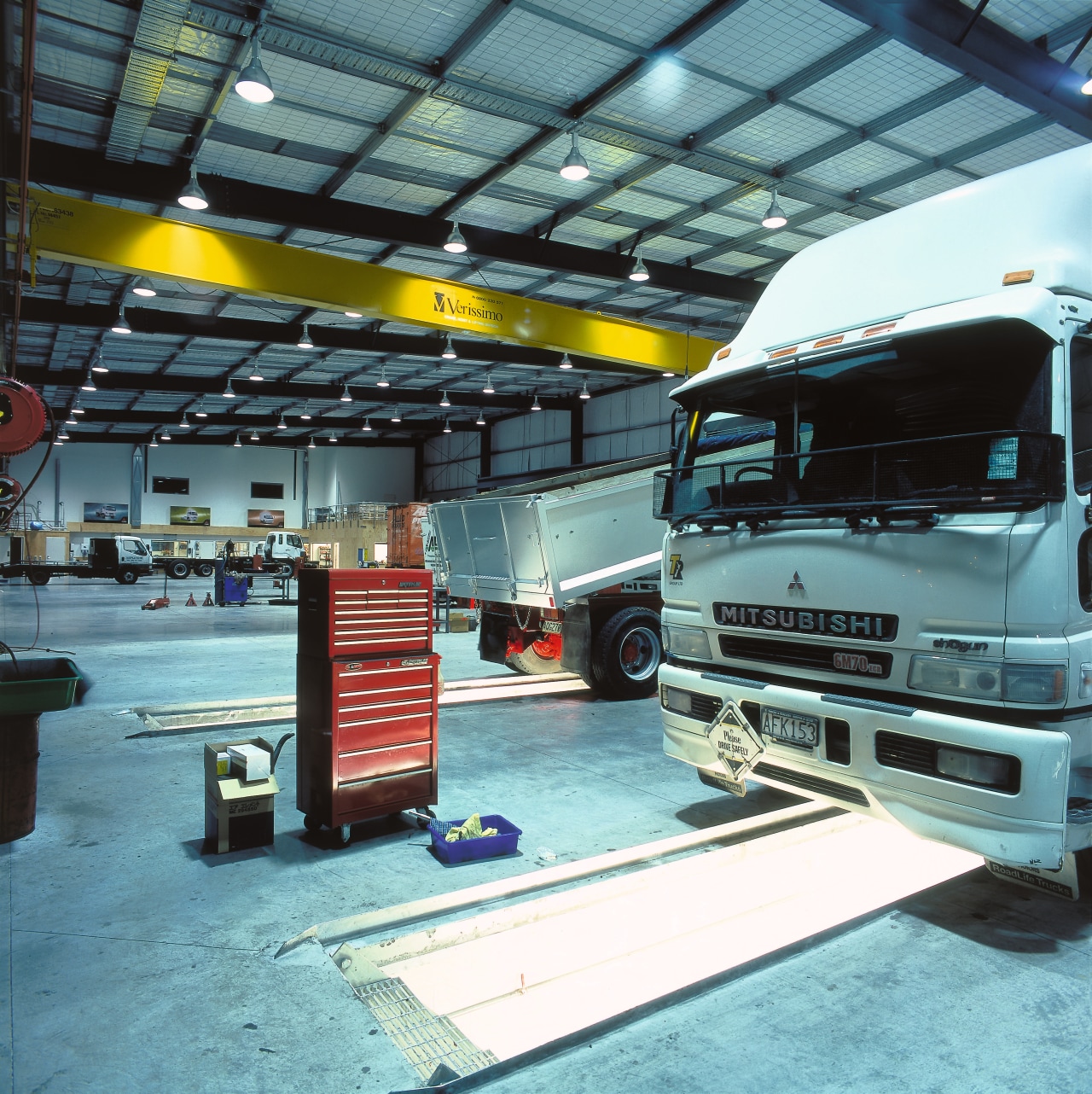 Interior view of truck workshop with pit areas automobile repair shop, automotive exterior, commercial vehicle, motor vehicle, transport, vehicle, teal