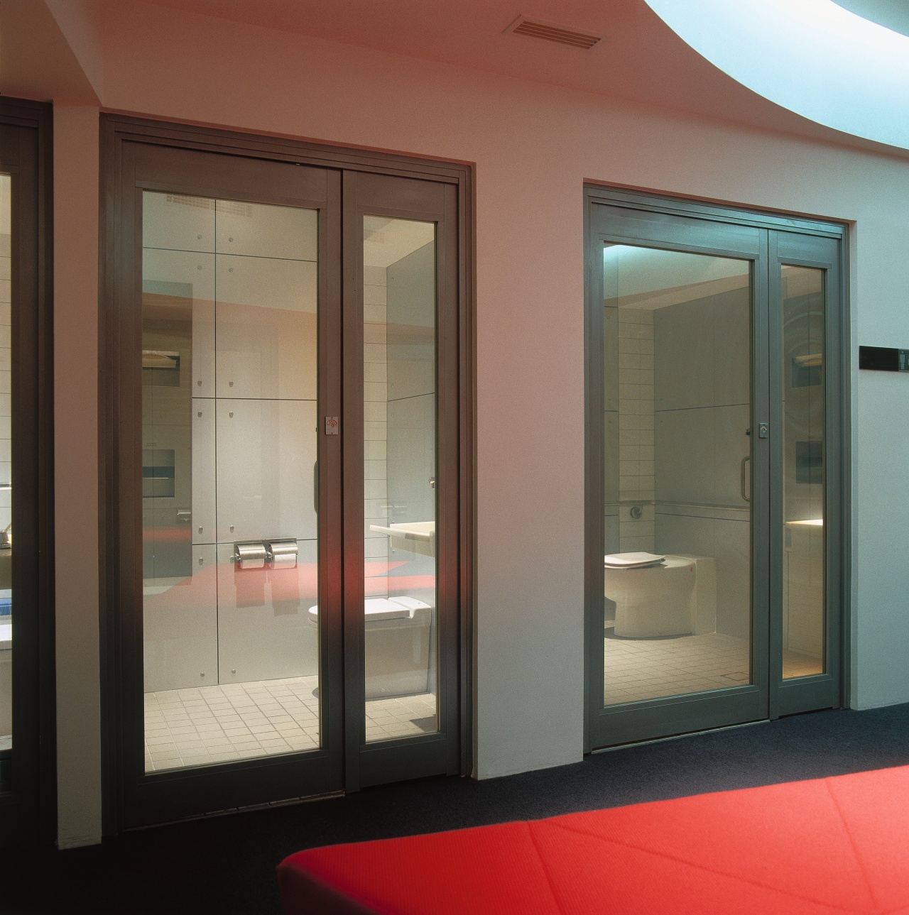 Hotel bathrooms with glass doors. door, glass, interior design, window, brown, gray, black