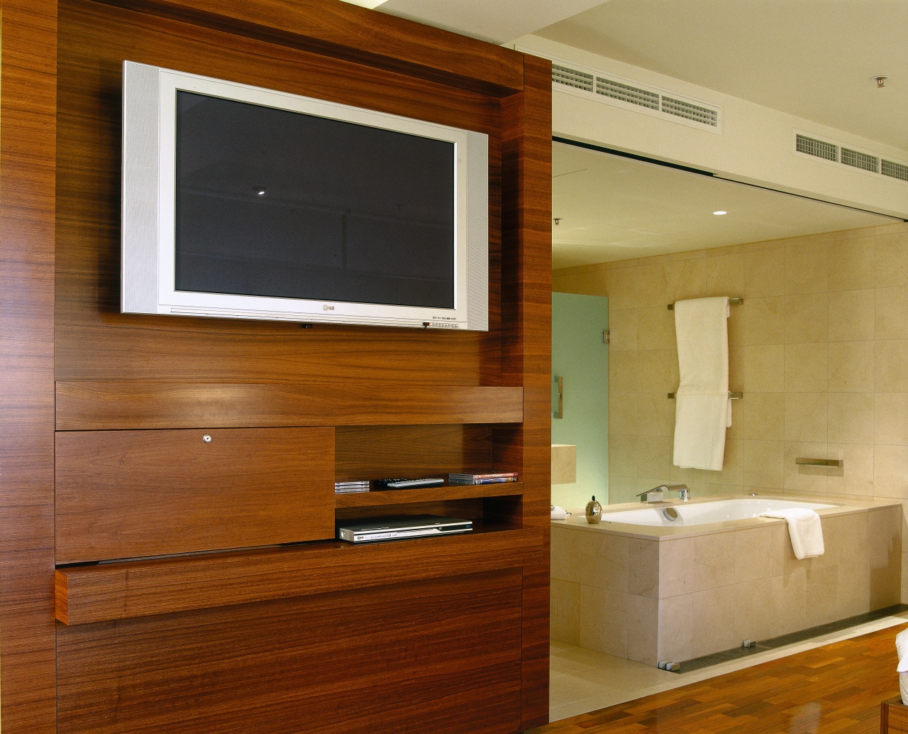 Hotel suite with built in timber veneer television cabinetry, floor, flooring, interior design, wood, brown