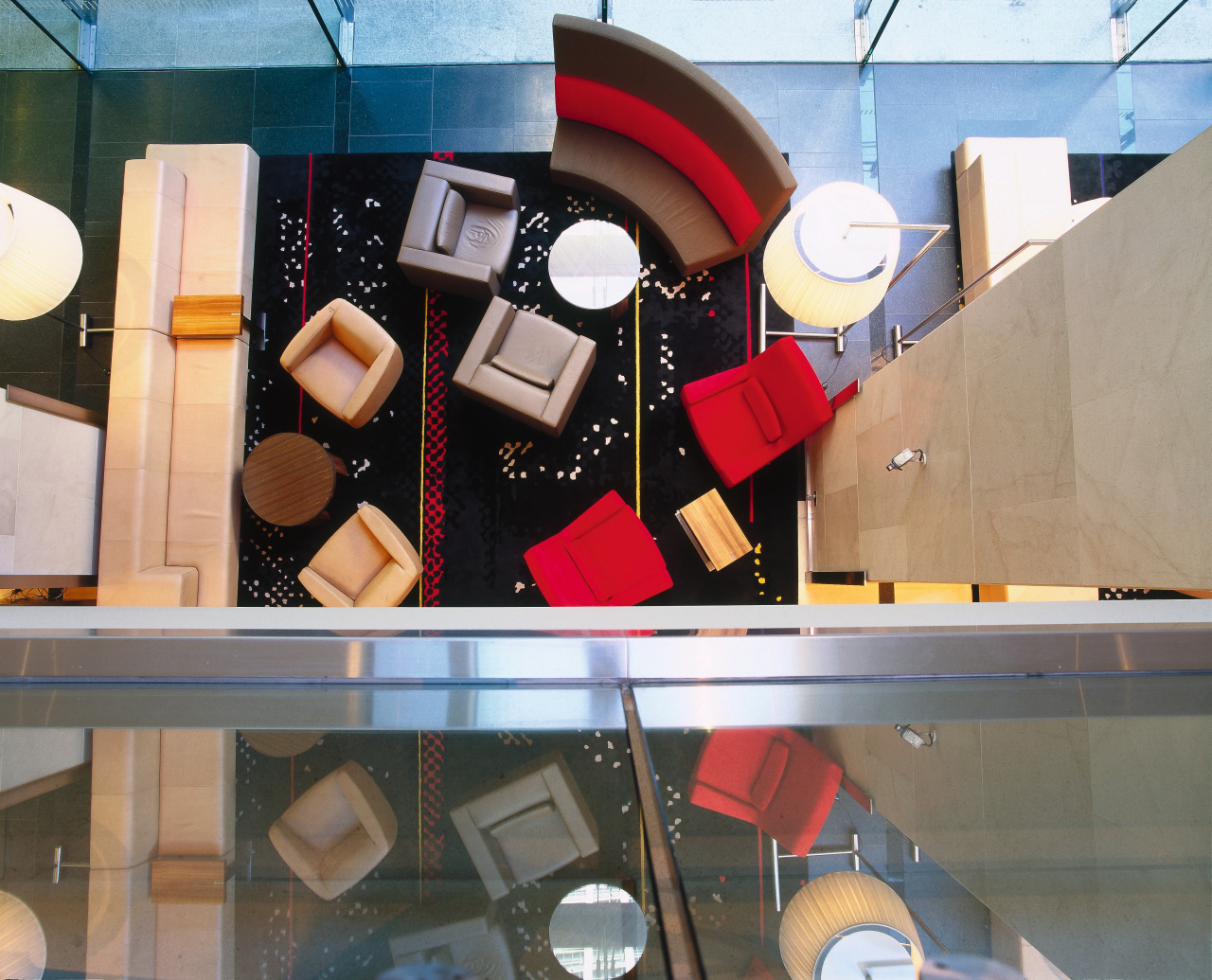 View looking straight down at hotel lobby with design, display window, product design, gray