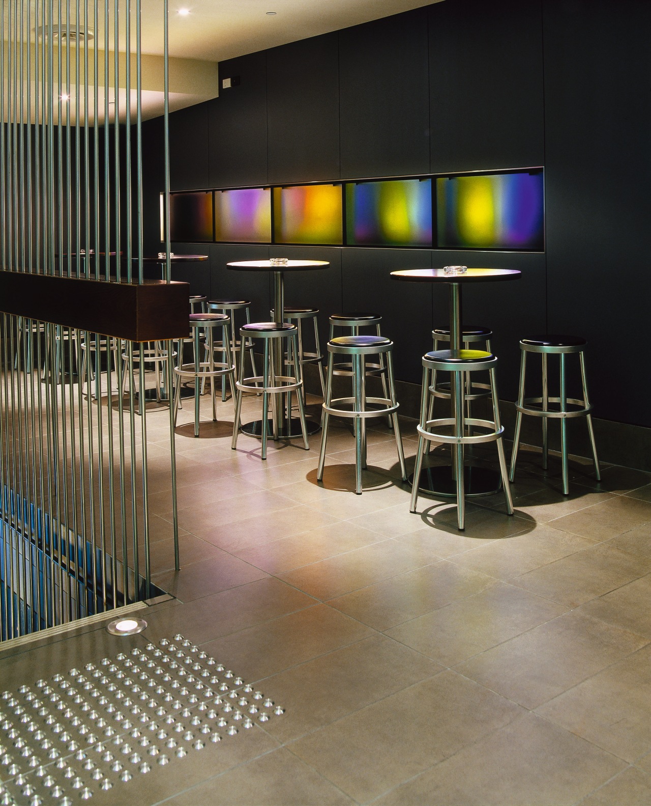 View of bar area with tiled flooring, bar floor, flooring, furniture, interior design, table, black, brown