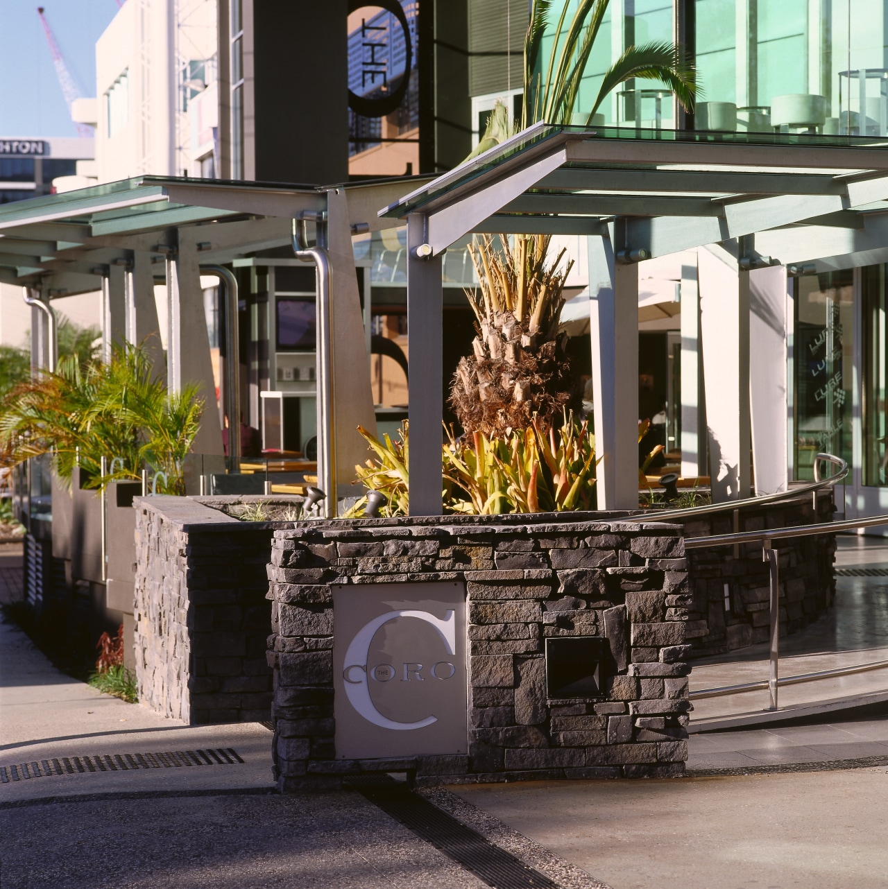 View of entranceway to Coro Hotel, featuring stone outdoor structure, black, gray