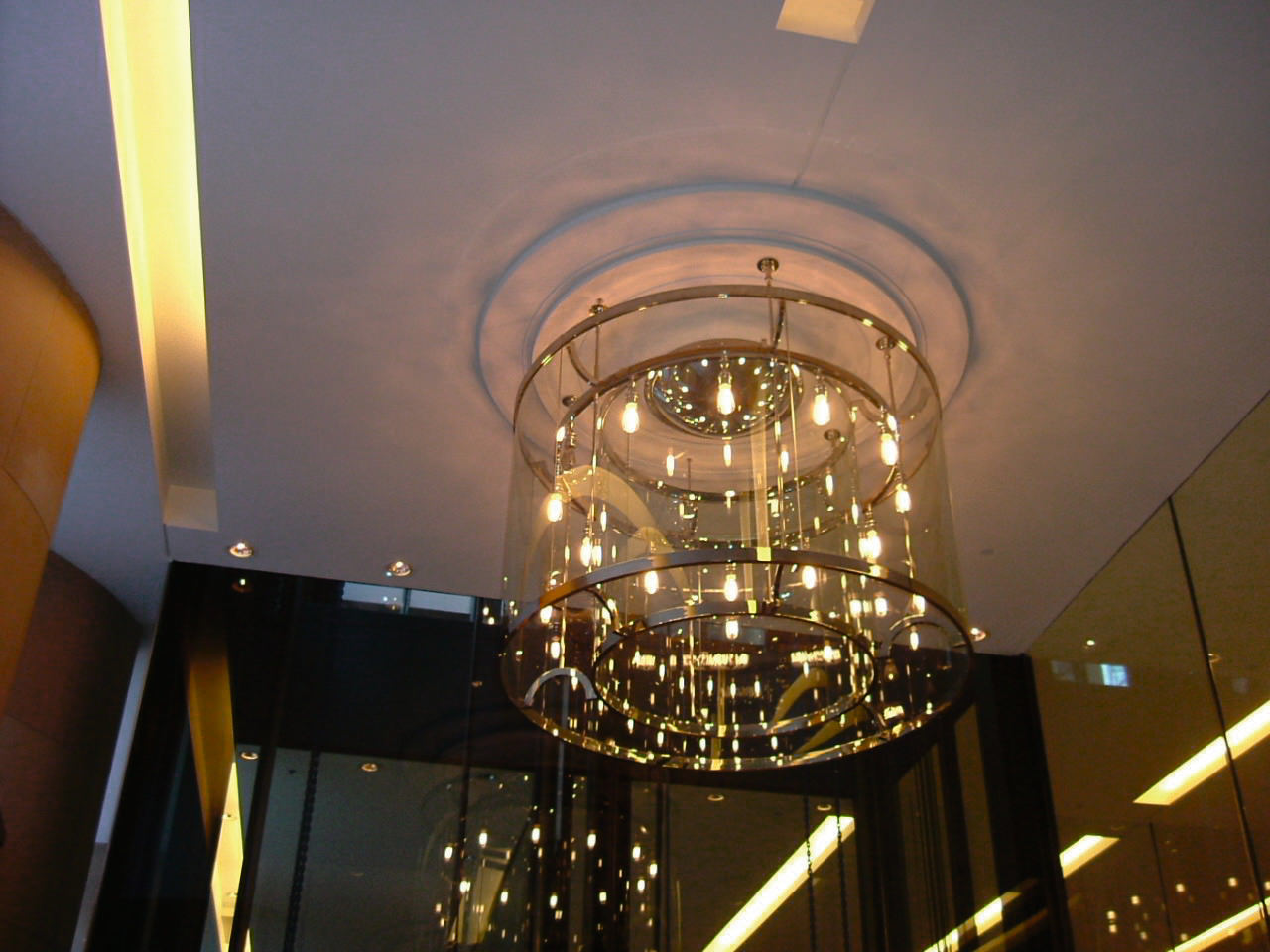 Custom made entrance light at the Hilton Sydney. architecture, ceiling, chandelier, light, light fixture, lighting, night, brown, gray