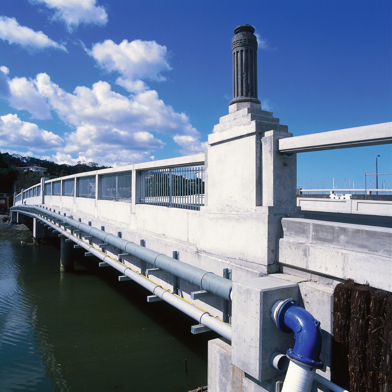 View of outside of road bridge. bridge, fixed link, sky, water, waterway, blue, black