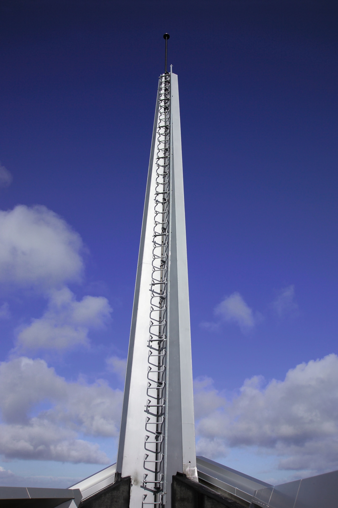 A view of the steel used on the building, cloud, daytime, fixed link, landmark, national historic landmark, sky, skyscraper, spire, steeple, tower, blue